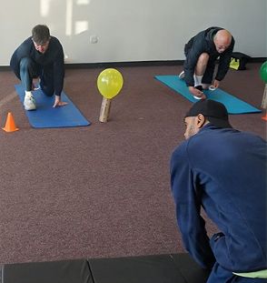 Adults stretching on exercise mats